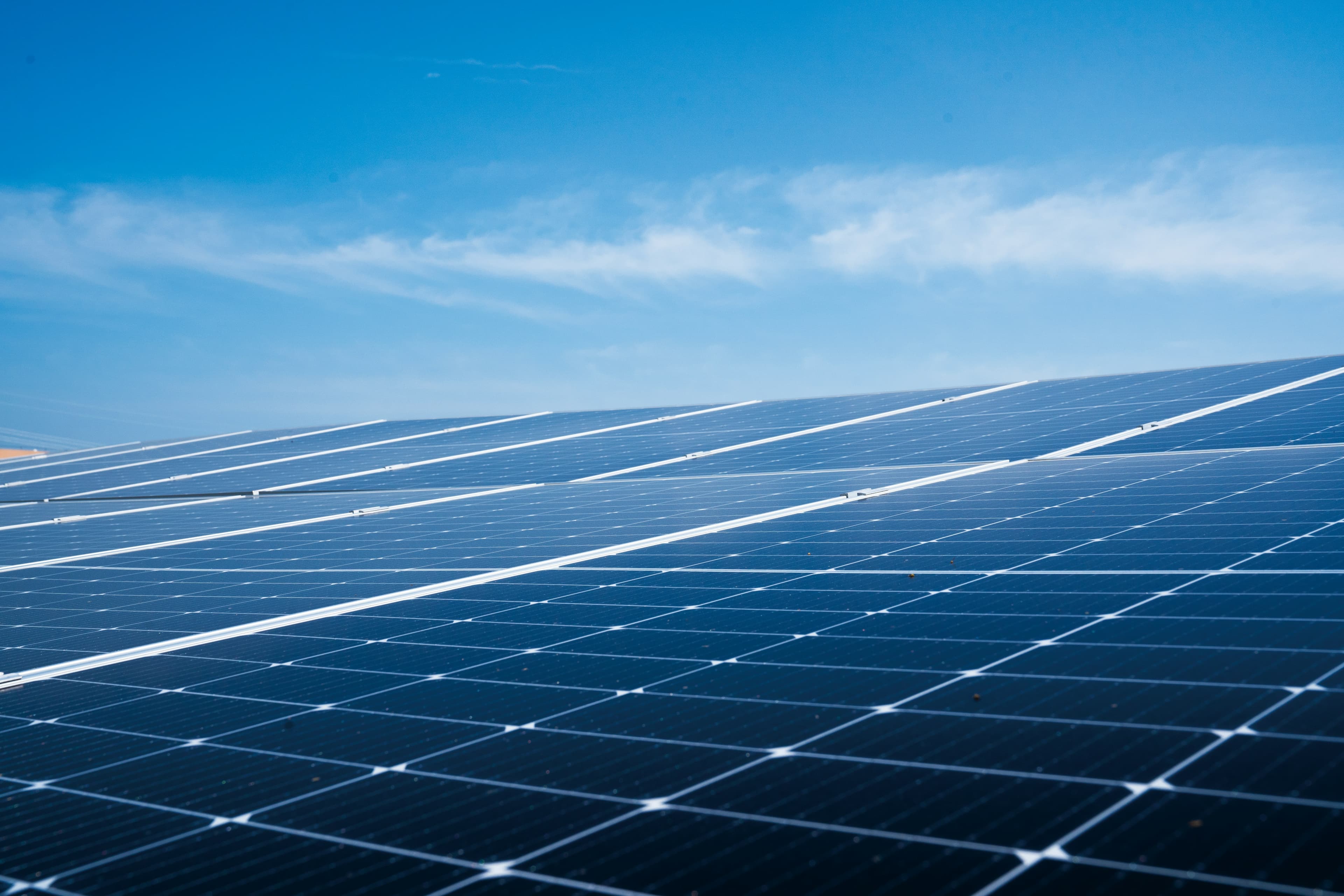 Close-up of solar panels under a blue sky